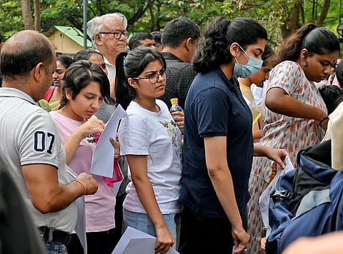 Students arrive at Army School on K Kamaraj Road to write NEET in Bengaluru. (Photo | Shashidhar Byrappa, EPS)