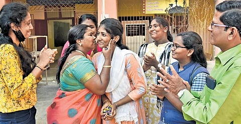 Gayatri being congratulated by her classmates and teachers at Perambur in Chennai on Monday | P Jawahar