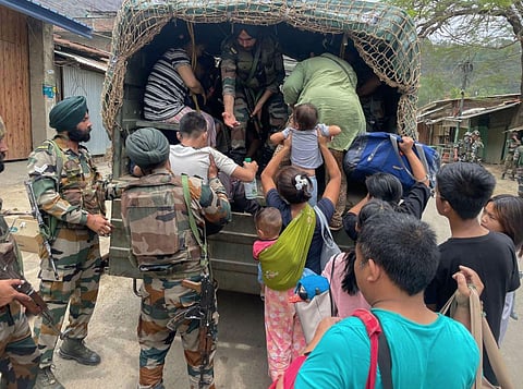Army personnel rescue people from a violence-hit area of Manipur, Saturday, May 6, 2023. (Photo | PTI)