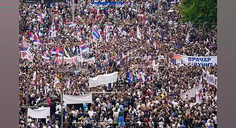 People attend a rally in support of President Aleksandar Vucic in front of the Serbian parliament building in Belgrade, Serbia. (Photo | AP)