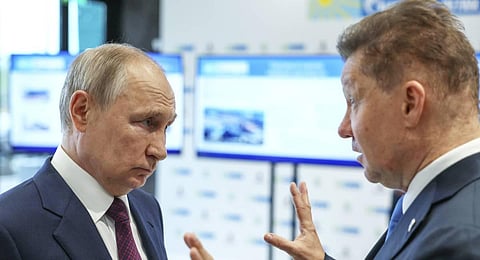 Russian President Vladimir Putin, left, speaks with Gazprom CEO Alexei Miller during his visit to a martial arts academy at Sirius Park. (Photo | AP)