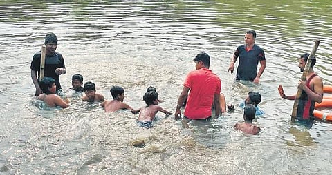 Children undergoing swimming training at Maindipur village | Express