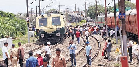 Railway workers trying to restore the train which got derailed near Basin Bridge railway station on Sunday  | p ravikumar