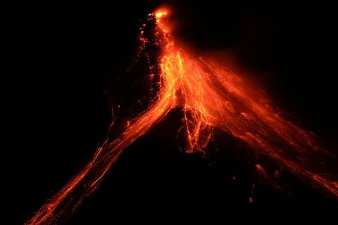 Lava flows down the slopes of Mayon volcano as seen from Daraga town, Albay province, northeastern Philippines, Tuesday, June 13, 2023.  (Photo | AP)