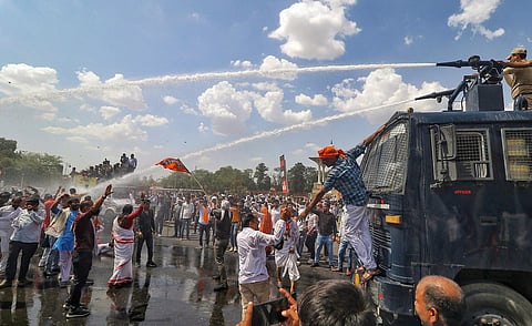 Police use water cannons to disperse the BJP supporters during their protest against the Rajasthan government, near the Secretariat office in Jaipur, Tuesday, June 13, 2023. (Photo | PTI)