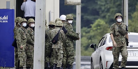 Japanese Self Defense Force members gather near a facility in a base firing range, following a deadly shooting in Gifu, central Japan, Wednesday, June 14, 2023. (Photo | AP)