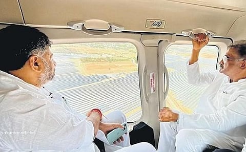 Deputy Chief Minsiter DK Shivakumar and Energy Minister KJ George conduct an aerial inspection of Pavagada solar park, on Wednesday | Express