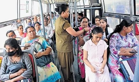 A conductor gives free tickets to women in a BMTC bus at Majestic  bus stand in Bengaluru | Shashidhar Byrappa