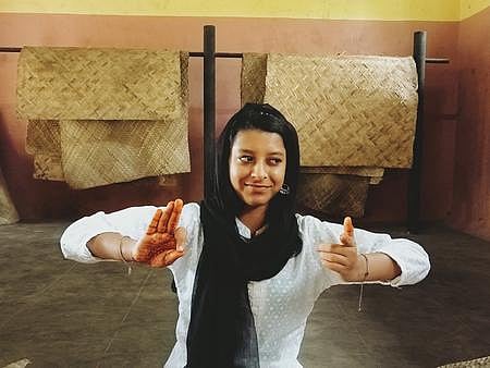 Saabri N trying out a kathakali mudra at the Kerala Kalamandalam