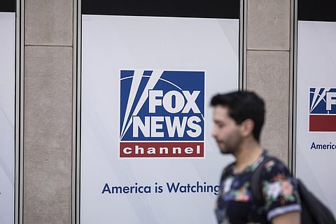 Representational Image: A person walks past the Fox News Headquarters in New York, April. 12, 2023. (Photo | AP)