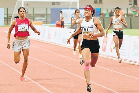 Anjali Devi (right) wins 400m ahead of R Vithya Ramraj (332) who finished third;