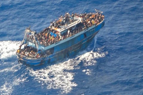 This image provided by Greece’s coastguard on June 14, 2023, shows a large number of people on a battered fishing boat that later capsized and sank off southern Greece. (AP)