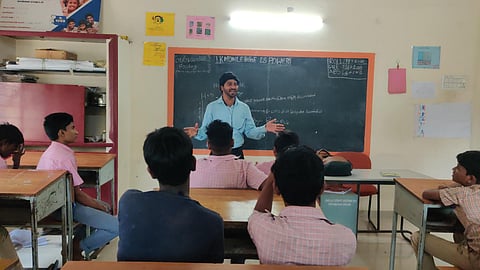 K Haridas, a  volunteer from PRISM Trust, taking classes for juvenile students.