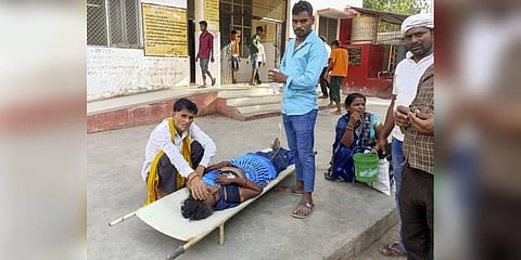 Family members with their patient at a hospital during heatwave conditions, in Ballia, Sunday, June 18, 2023. (Photo | PTI)