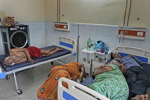 People lie at the overcrowded district hospital in Ballia, Uttar Pradesh state, India, Monday, June 19, 2023. (Photo | AP)