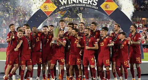 Spain players celebrate with the trophy after winning the Nations League final. (Photo | AP)