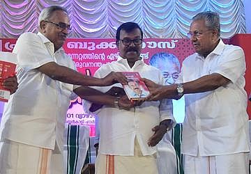 Chief minister Pinarayi Vijayan releasing CPI veteran C Divakaran's autobiography 'Kanalvazhikaliloode' by handing over a copy to CPI state chief Kanam Rajendran (Photo | EPS)
