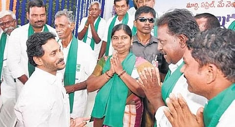 CM Jagan interacting with farmer representatives during a programme  to disburse aid under YSR Rythu Bharosa at Pattikonda | Express