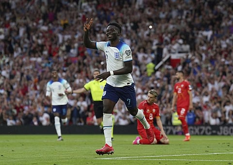 England's Bukayo Saka celebrates after scoring his hat-trick during the Euro 2024 Qualifying Group C fixture against North Macedonia at Old Trafford, Manchester, June 19, 2023. (Photo | AP)