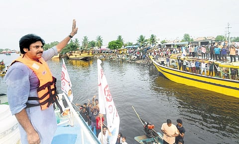 Jana Sena chief Pawan Kalyan greeting fishermen at Ettimogga on Monday I express