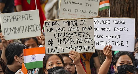 File photo of people belonging to the Kuki tribe protest against the killing of tribals in violence-hit Manipur, in New Delhi. (Photo | PTI)