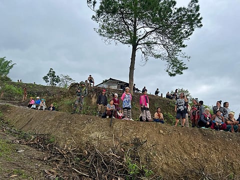 Villagers look on army personnel demolish bunkers erected by the miscreants at Leimakhong near the border of Kangpokpi and Imphal East districts. (Photo|Special arrangement)