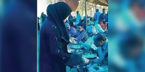 A Muslim woman serves food at the resting centre at Poovathinkeezhil