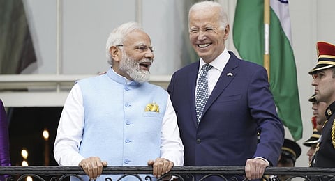 Prime Minister Narendra Modi and President Joe Biden talk on the Blue Room Balcony during a State Arrival Ceremony at the White House .(Photo | AP)