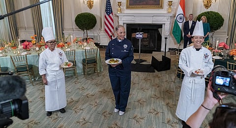 White House chefs Cristeta Comerford (L), Susan Morrison (R) and guest chef Nina Curtis hold dishes during a media preview on Wednesday, June 21, 2023. (Photo | AP)