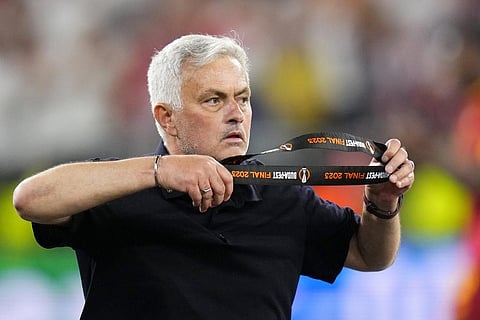 Roma's head coach Jose Mourinho takes off his second place medal after receiving it at the end of the Europa League final against Sevilla at the Puskas Arena in Budapest (Photo | AP)