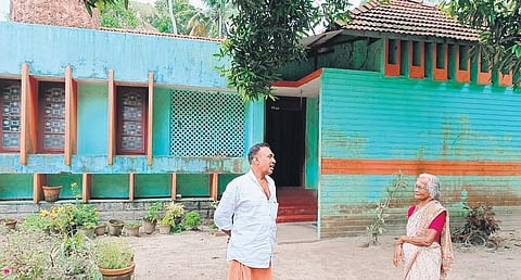 Sundarambal and her son Joshy in front of their house in Poochakkal, Cherthala