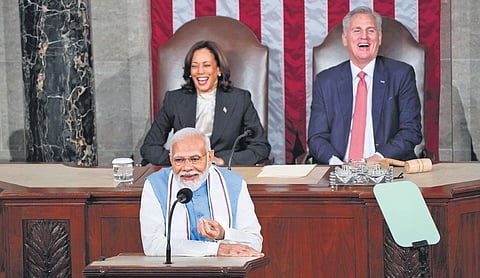 US Vice President Kamala Harris and House Speaker Kevin McCarthy laugh as PM Narendra Modi makes a joke during his address to the US Congress. (Photo | AP)