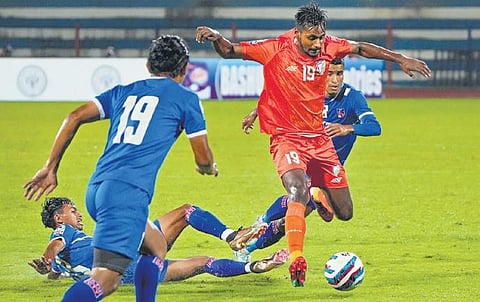 India’s Rohit Kumar (L) vies for the ball against Nepal on Saturday. (Photo | PTI)