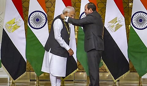 Egyptian President Abdel Fattah El-Sisi confers Prime Minister Narendra Modi with 'Order of the Nile' award during their meeting in Cairo, Egypt, June 25, 2023. (Photo | PTI)