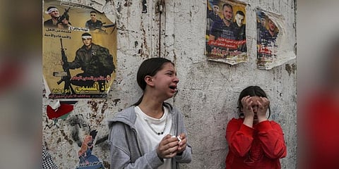 Representational Image: Relatives of Palestinian fighter Fathi Abu Rizk, who was killed overnight during his funeral in the Balata camp for Palestinian refugees in West Bank. (Photo | AFP)