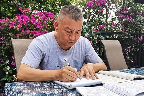 Undaunted Spirit: Liang Shi says he's not willing to give up. (Photo | AFP)