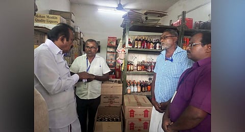 Minister S Muthusamy inspecting a shop at Kathirampatti in Erode. (Photo | Express)