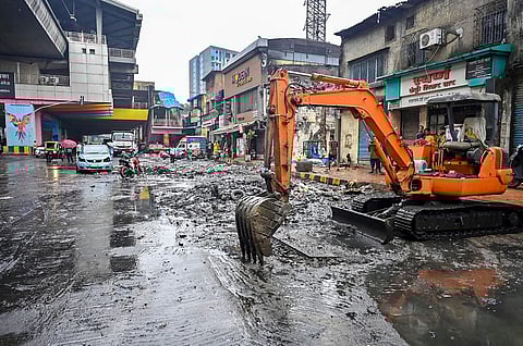 BMC officials remove roadside garbage at Saki Naka after rainfall, in Mumbai, Sunday, June 25, 2023. (Photo | PTI)