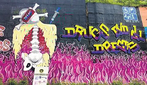 A graffiti art to raise awareness about the detrimental effects of drug abuse painted on the walls of the BR Ambedkar Open University in Hyderabad