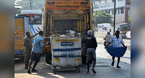 Corporation workers collecting garbage and loading it in trucks in Chennai. (Photo | Ashwin Prasath, EPS)