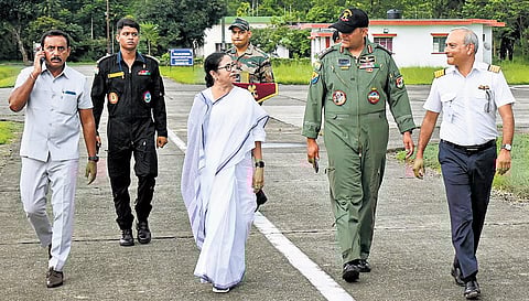 CM Mamata Banerjee with Army officials after her helicopter made a precautionary landing at Sevoke Road Army Aviation Base, in Siliguri on Tuesday. (Photo | PTI)