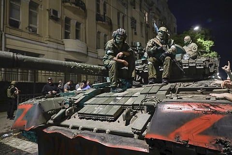 Members of the Wagner Group sit atop a tank on a street in Rostov-on-Don, Russia, Saturday, June 24, 2023, prior to leaving an area at the headquarters of the Southern Military District. (Photo | AP)