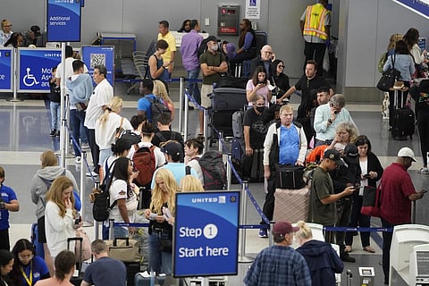 Travellers wait at the departure area check-in at the United Airlines terminal at Los Angeles International Airport, June 28, 2023. (Photo | AP)