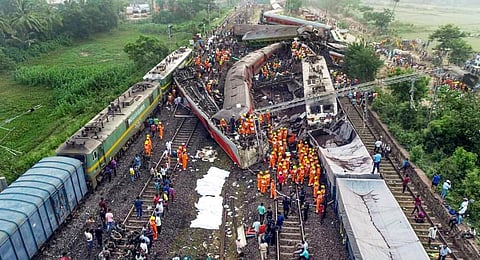 Locals, security personnel and NDRF during the search and rescue operation at the site.(Photo | PTI)