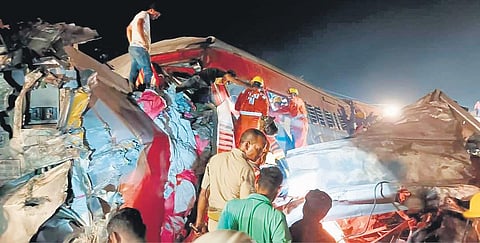 Rescue workers look for survivors at the accident site, in Bahanaga on Friday | Express