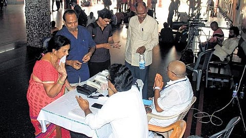 ​  People anxiously make enquires at the helpdesk at the Visakhapatnam railway station on Saturday | G Satyanarayana  ​