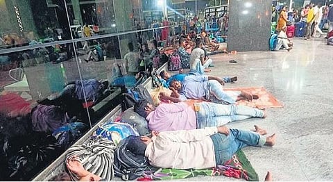 ​  As trains to Odisha, Bihar and West Bengal were cancelled, passengers were left stranded at SMVT station in Bengaluru since Friday evening | Express  ​