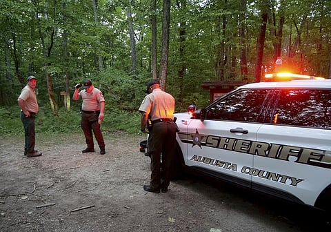 Authorities at the rescue operation along the Blue Ridge Parkway where a Cessna Citation crashed over mountainous terrain near Montebello, Virginia on June 4, 2023. (AP)