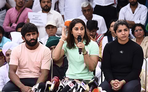 Agitating wrestlers (from L) Bajrang Punia, Vinesh Phogat and Sakshi Malik address the media during at Jantar Mantar in New Delhi. (Photo | Parveen Negi, EPS)