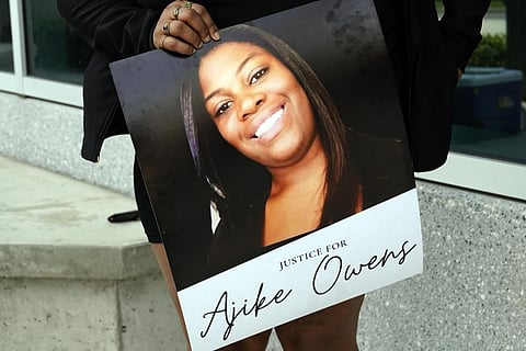 A protester, holds a poster of Ajike Owens at the Marion County Courthouse, June 6, 2023, in Ocala, demanding the arrest of a woman who shot and killed Owens on June 2. (Photo | AP)